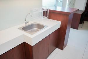 Comfy and Nice Studio at Tree Park City BSD Apartment By Travelio
