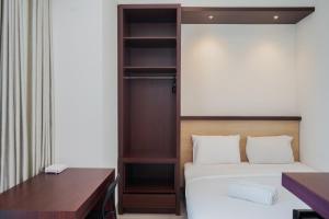 Comfy and Nice Studio at Tree Park City BSD Apartment By Travelio