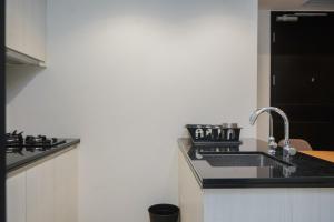 Nice and Homey 1BR at Branz BSD City Apartment By Travelio