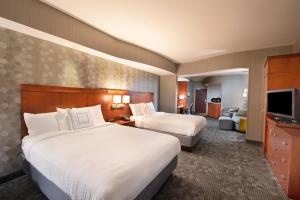 Queen Studio with Two Queen Beds and Sofa Bed room in Courtyard Atlanta McDonough