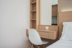 Comfort and Cozy Studio at Casa De Parco Apartment By Travelio