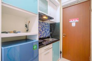 Homey and Cozy Living Studio Room at Tifolia Apartment By Travelio