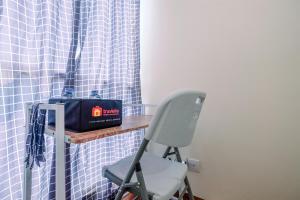 Homey and Cozy Living Studio Room at Tifolia Apartment By Travelio