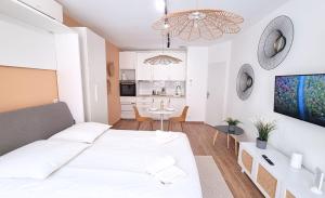 Appartements FLORAL Neuf- Climatise - Centre ville : photos des chambres