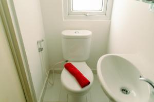 Cozy Studio Apartment at Aeropolis Residence No Kitchen near CGK Airport By Travelio