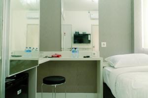 Cozy Studio Apartment at Aeropolis Residence No Kitchen near CGK Airport By Travelio