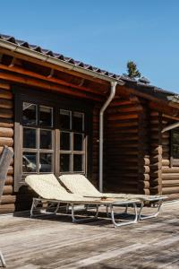 Authentic Log House Amid Evergreens In Vendsyssel