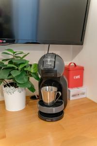 Appartements La p-tite Auxerroise, mini-maison avec jardin ! : photos des chambres