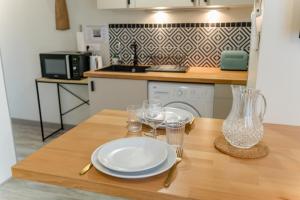 Appartements La p-tite Auxerroise, mini-maison avec jardin ! : photos des chambres