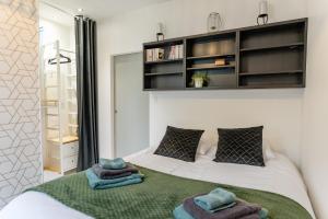 Appartements La p-tite Auxerroise, mini-maison avec jardin ! : photos des chambres