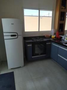 Casa perto da praia com piscina e churrasqueira