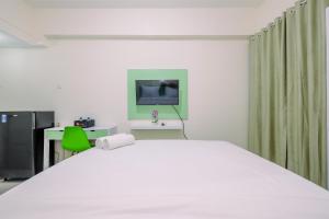 Comfortable and Minimalist Studio at Bogorienze Apartment By Travelio