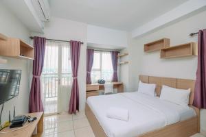 Cozy Stay Studio Apartment at Margonda Residence 5 By Travelio