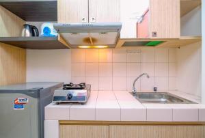 Homey and Simply Studio Room at Margonda Residence 3 Apartment By Travelio