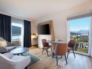 Deluxe King Corner Room with Sofa Bed room in Ramada Innsbruck Tivoli