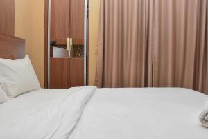 Good Choice Studio at Green Pramuka Apartment near Shopping Center By Travelio