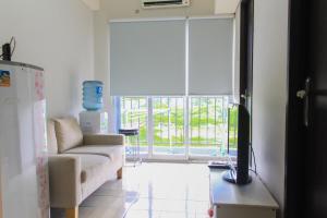 Comfy and Best View 2BR at Serpong Greenview Apartment By Travelio