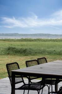 House By Forest And Roskilde Fjords Waves