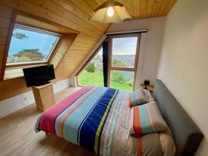 Maisons de vacances House with sea view and large garden for 8 people : photos des chambres