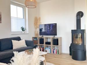 Reethaus "MeerZeit" mit Kamin, Sauna und 3 Schlafzimmern