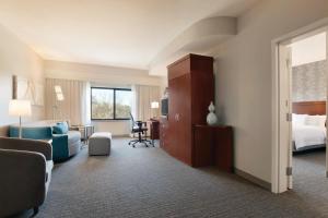 Hospitality King Suite with Sofa Bed room in Courtyard Charlotte Airport North