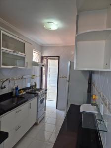 Apartamento com três quartos pé na areia