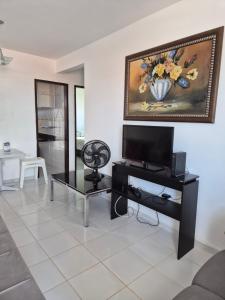 Apartamento com três quartos pé na areia