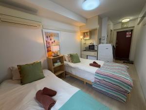 Shinjuku Yotsuya Sanchome Station 7-minute walk Hawaiian Twin Bed Charm Room 1R