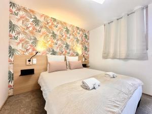 Appartements La Roseraie - Hyper Centre - Parking Privatif : photos des chambres