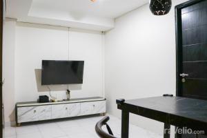Warm and Homey 2BR at Sentraland Cengkareng Apartment By Travelio