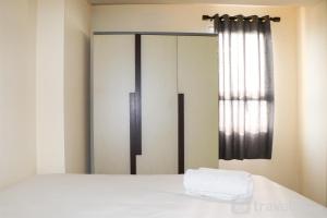 Best Strategic 2BR Apartment at Green Palm Residence By Travelio