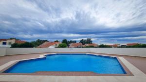 Maisons de vacances Maisonnette familiale climatisee dans residence avec piscine : photos des chambres