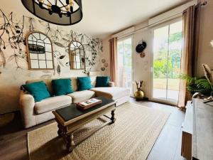 Appartements Le Plessis Capitale - Appartement entier avec jardin : photos des chambres