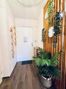 Appartements Le Plessis Capitale - Appartement entier avec jardin : photos des chambres