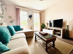 Appartements Le Plessis Capitale - Appartement entier avec jardin : photos des chambres