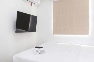 Homey and Simply 2BR at Lagoon Bekasi Town Square Apartment By Travelio