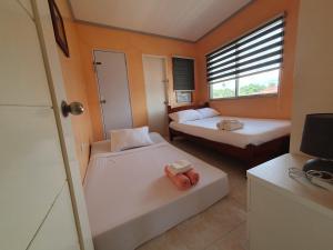 Simala Beach House Beachfront 4BR Retreat by the Sea