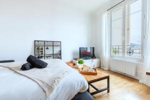 Appartements Le Clair & Spacieux - Parking - 15 min Paris : photos des chambres