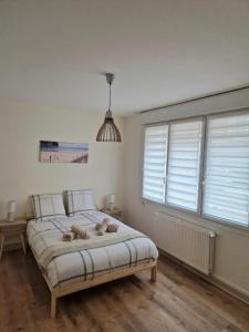 Appartements Caprices des vagues - A 300 m de la plage et a 4 kilometres de Nausicaa, Place de parking privee, Eau douce, Netflix, Primes Video, Wifi haut debit : photos des chambres