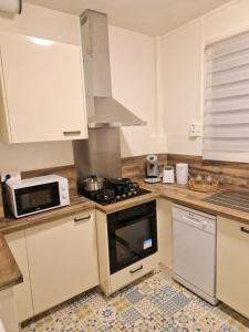 Appartements Caprices des vagues - A 300 m de la plage et a 4 kilometres de Nausicaa, Place de parking privee, Eau douce, Netflix, Primes Video, Wifi haut debit : photos des chambres
