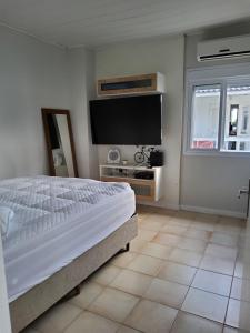 Casa beira da Lagoa da Conceição