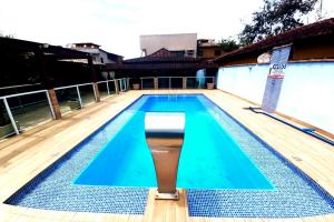 Casa com churrasqueira e piscina próximo da praia