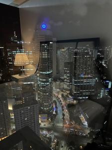 King size bed at Air Residences Condo, Ayala Ave, Makati