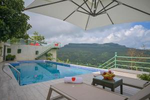 SaffronStays Lords Pavilion - 6BR Luxury Villa with Lawn & Cricket Turf near Pawna