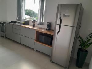 2 vagas de estacionamento, a 7 min da praia