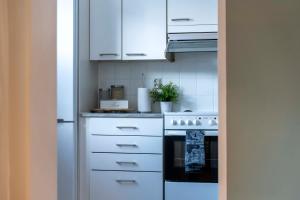 Central and cozy home by the train station with free parking