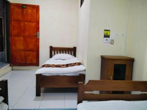 Penginapan Bunga Sonsang kamar Family Tripel