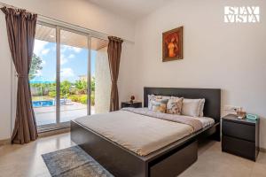 StayVista at The Green Orchid with Pool, WiFi