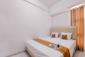 Comfort and Nice 1BR at Akasa Pure Living BSD Apartment By Travelio