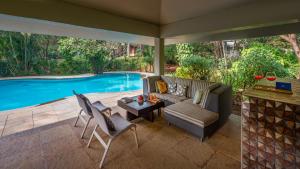 SaffronStays Laguna - 4BR vintage-chic villa with unique pool, gazebo & terrace sit-outs near Mandwa Jetty, Alibaug